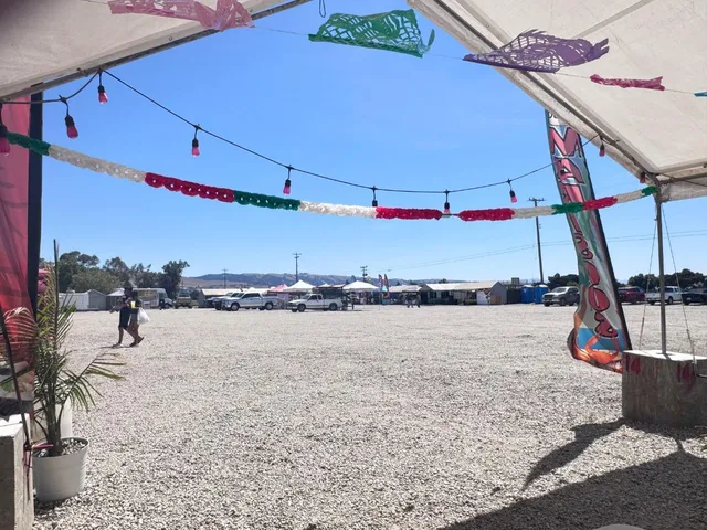 a city street view with tall buildings and a bench