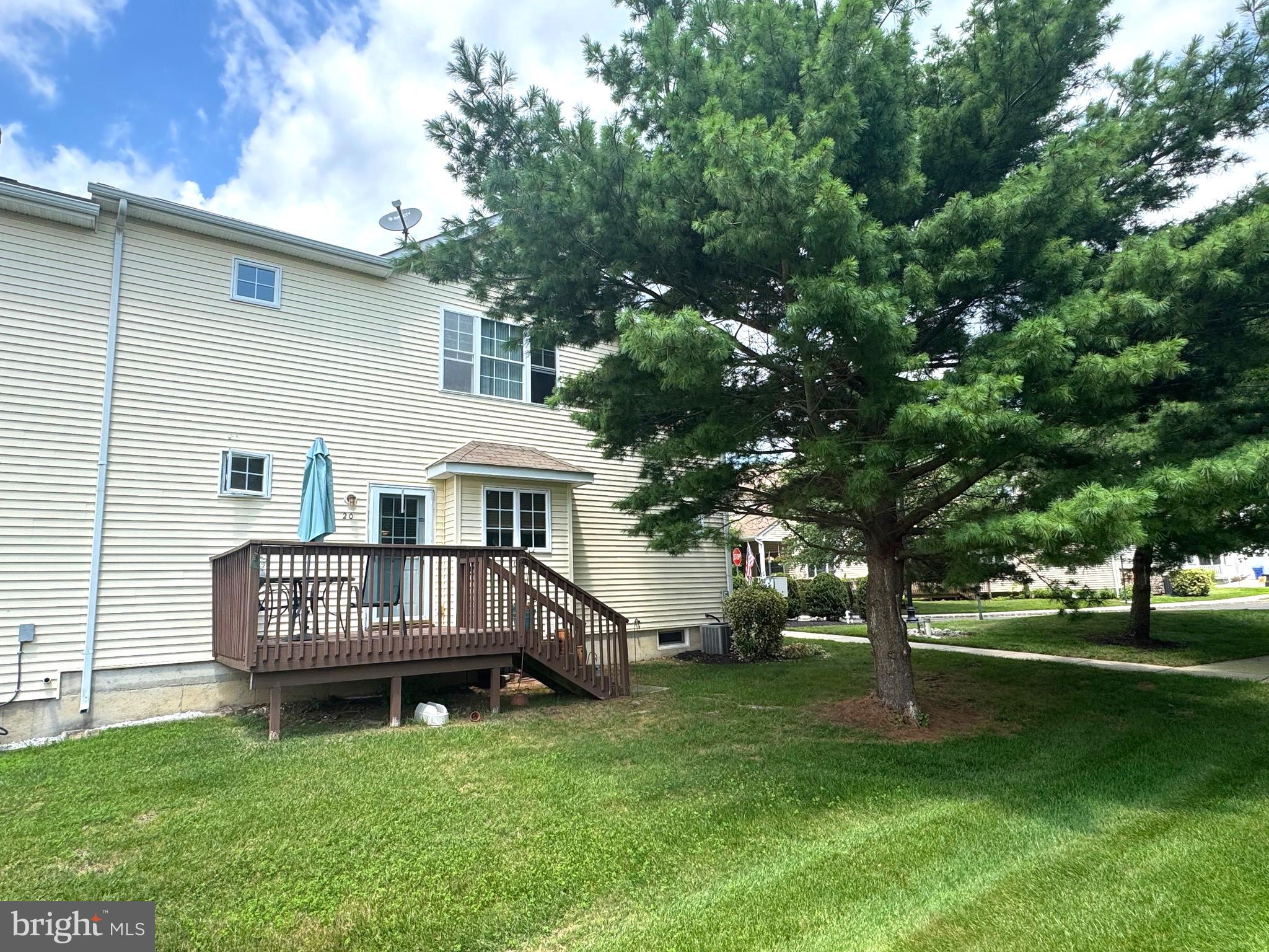 20 Wilson Way Delanco, NJ 08075 - Photo 5 of 38 a view of a house with a yard deck and a small yard