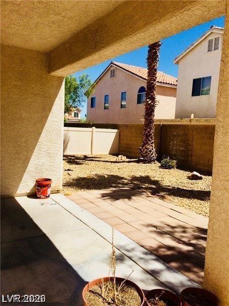 8897 Houston Ridge Avenue Las Vegas, NV 89178 - Photo 10 of 12 A spacious backyard awaits, ready for your personal touch and outdoor vision.