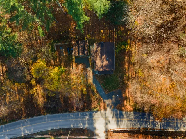 an aerial view of residential house with outdoor space