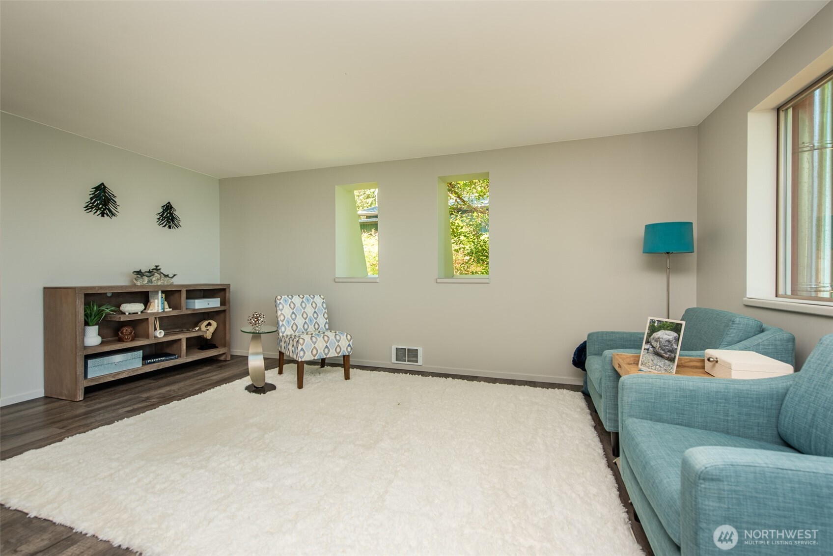 681 Bachelor Road Sequim, WA 98382 - Photo 11 of 39 a living room with furniture and a flat screen tv