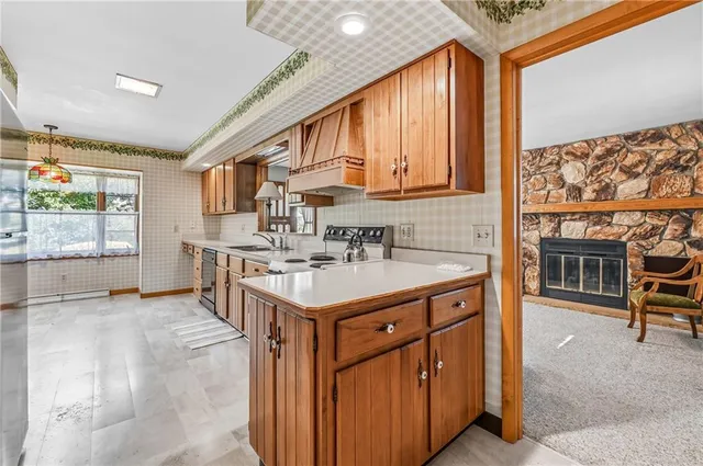 a kitchen with sink cabinets and outdoor view