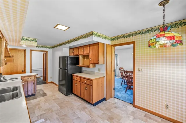 a kitchen that has a lot of cabinets in it