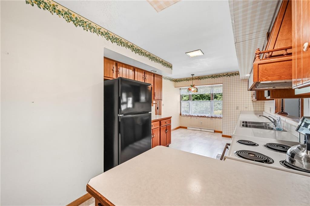 400 Hazen Road Sharpsville, PA 16150 - Photo 14 of 49 a kitchen with stainless steel appliances a refrigerator and a stove