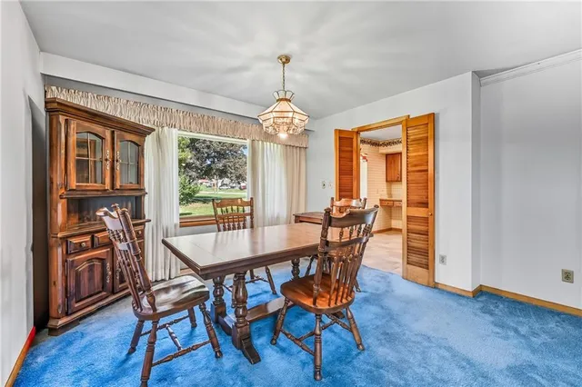 a dining room with furniture window wooden floor