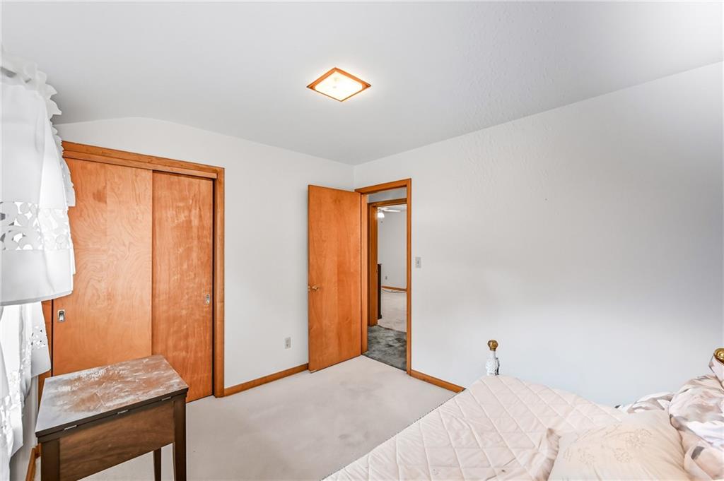 400 Hazen Road Sharpsville, PA 16150 - Photo 22 of 49 a bedroom with a bed and a lamp