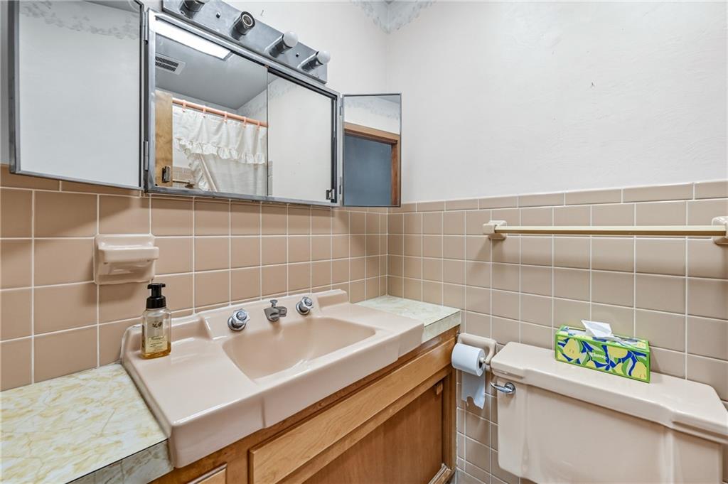 400 Hazen Road Sharpsville, PA 16150 - Photo 32 of 49 a bathroom with a sink toilet and a mirror