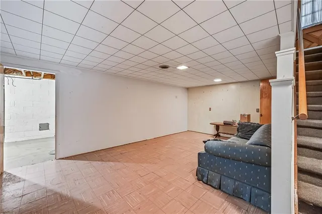 a living room with furniture and a rug