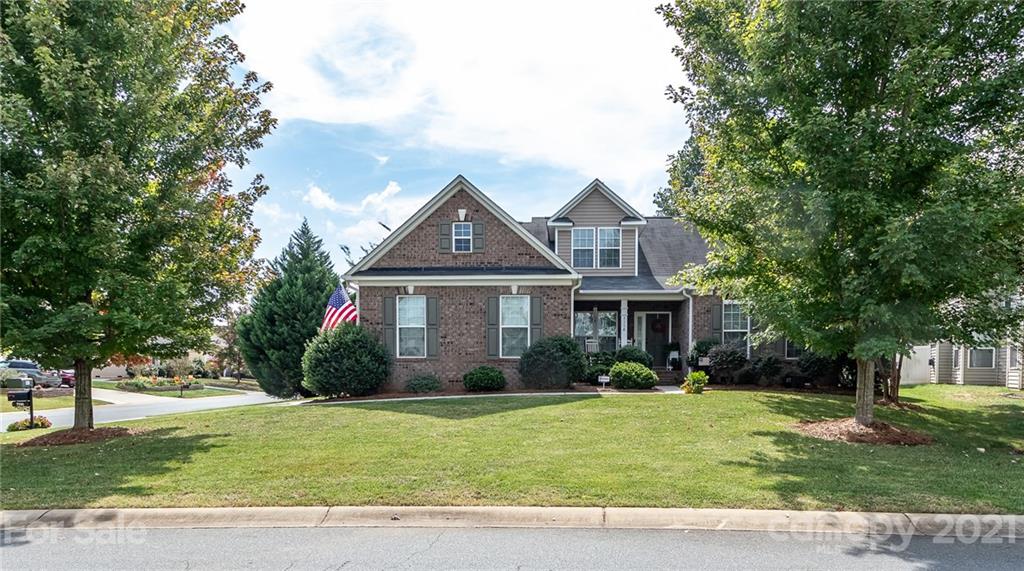 7116 Meyer Road Fort Mill, SC 29715 - Photo 1 of 31 a front view of a house with a garden