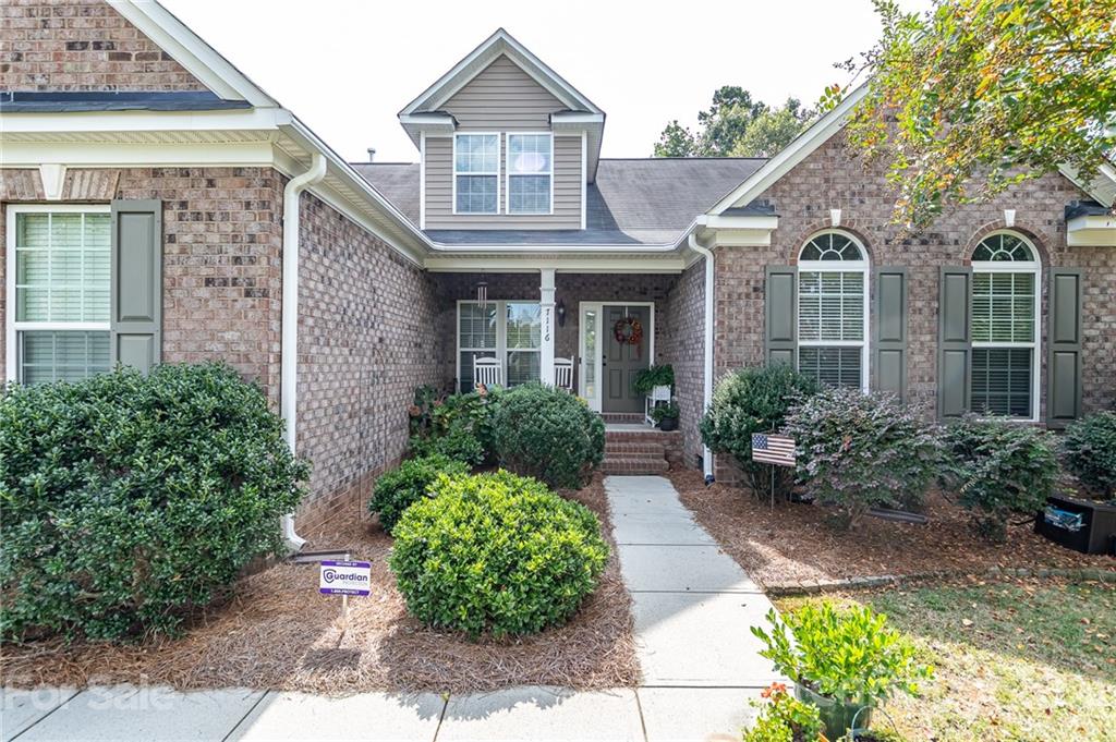 7116 Meyer Road Fort Mill, SC 29715 - Photo 2 of 31 a front view of a house with garden