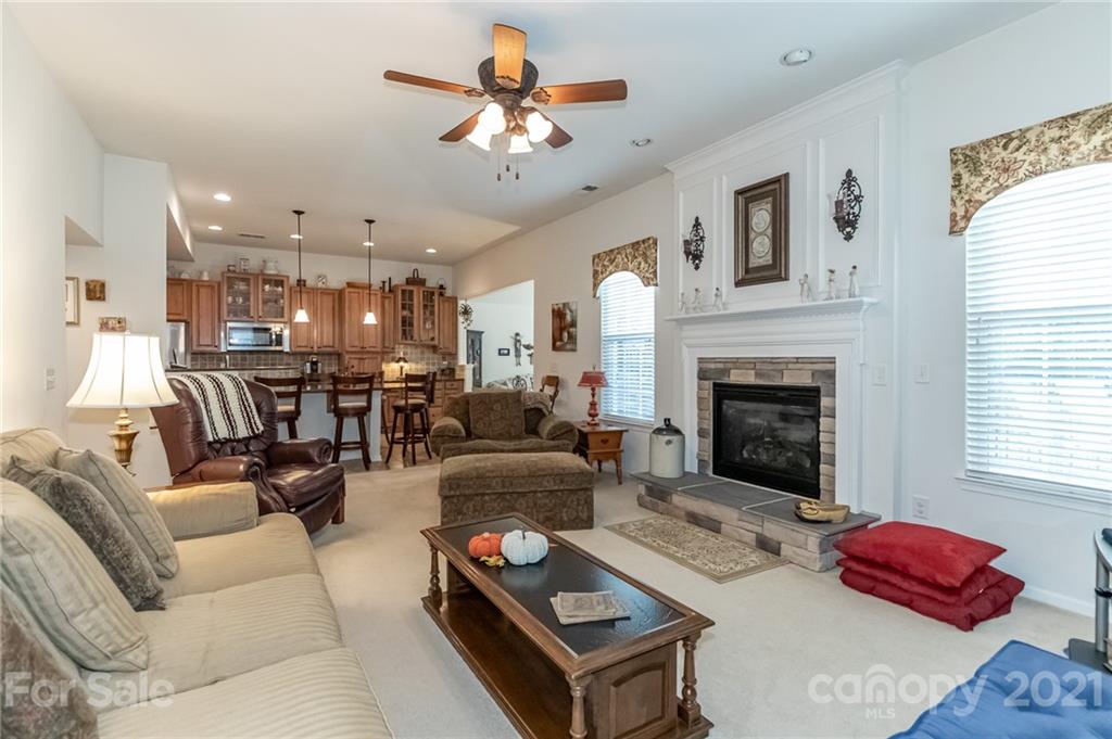 7116 Meyer Road Fort Mill, SC 29715 - Photo 12 of 31 a living room with furniture fireplace and a window
