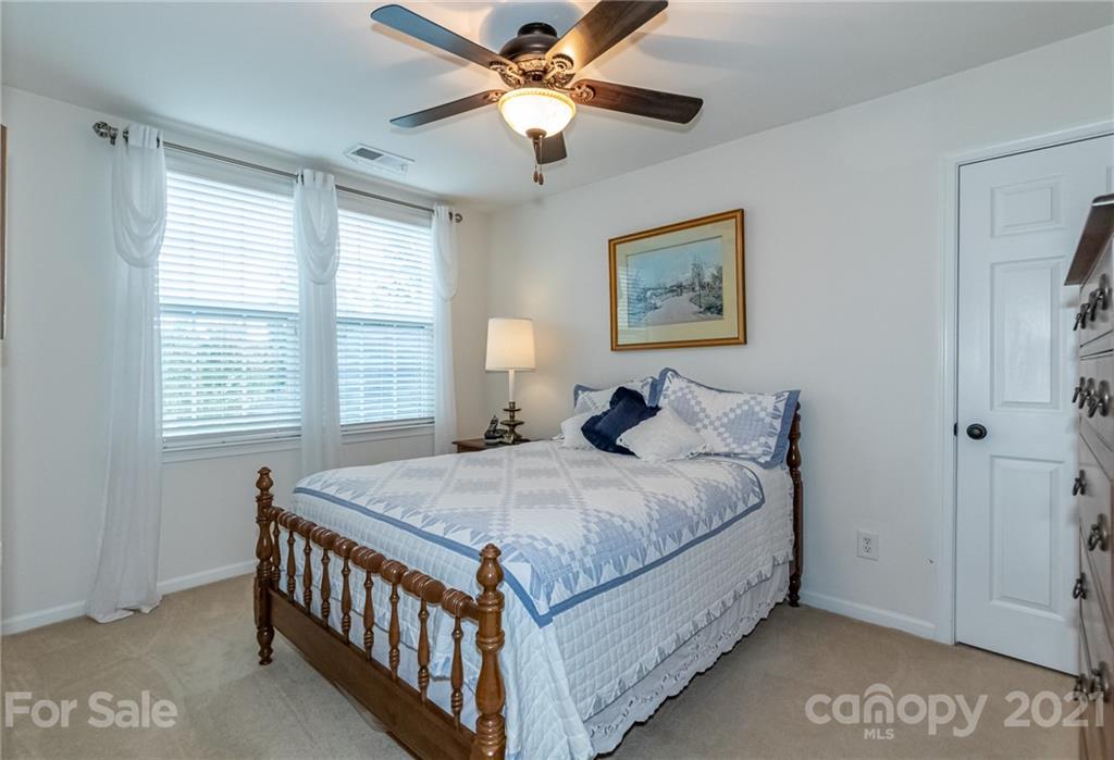 7116 Meyer Road Fort Mill, SC 29715 - Photo 25 of 31 a bedroom with a bed and a window