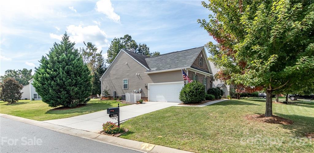 7116 Meyer Road Fort Mill, SC 29715 - Photo 28 of 31 a front view of a house with garden