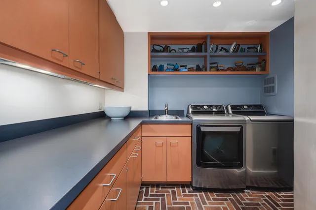 a kitchen with stainless steel appliances granite countertop a stove a microwave and cabinets