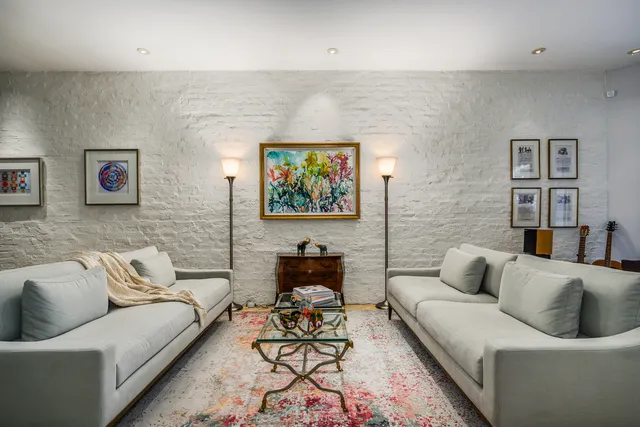 a living room with furniture or couch and a couch