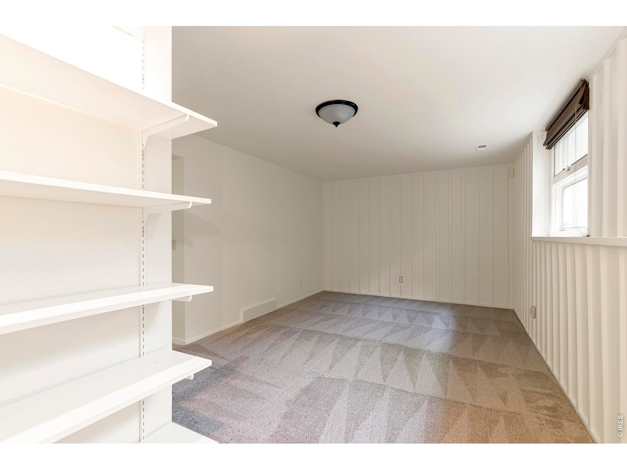 3856 14th Street Boulder, CO 80304 - Photo 30 of 48 Versatile basement bonus room ideal for a lounge, workout space, or home office