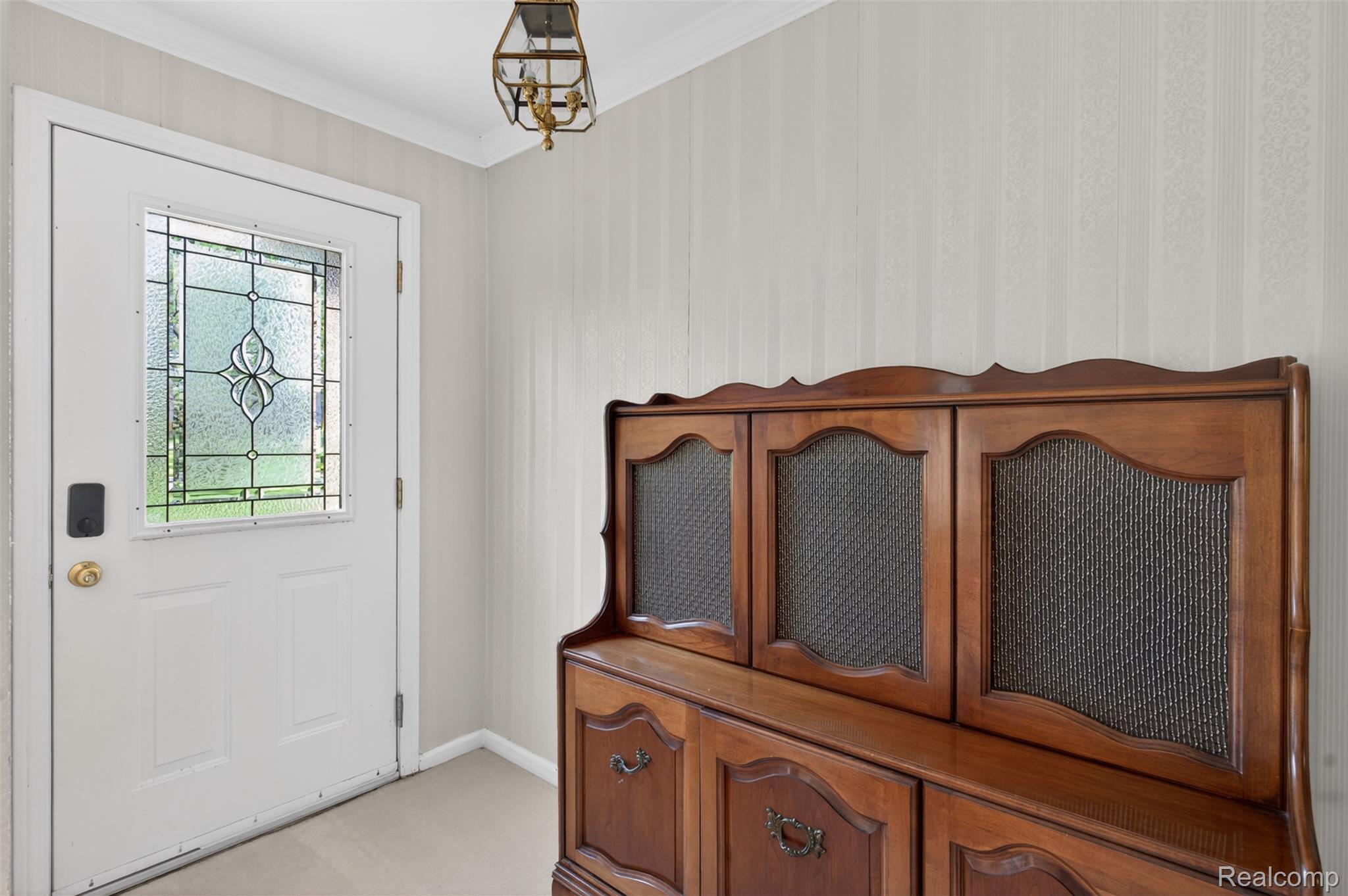 15623 Millar Road Clinton Township, MI 48036 - Photo 24 of 56 Entryway featuring crown molding and light colored carpet