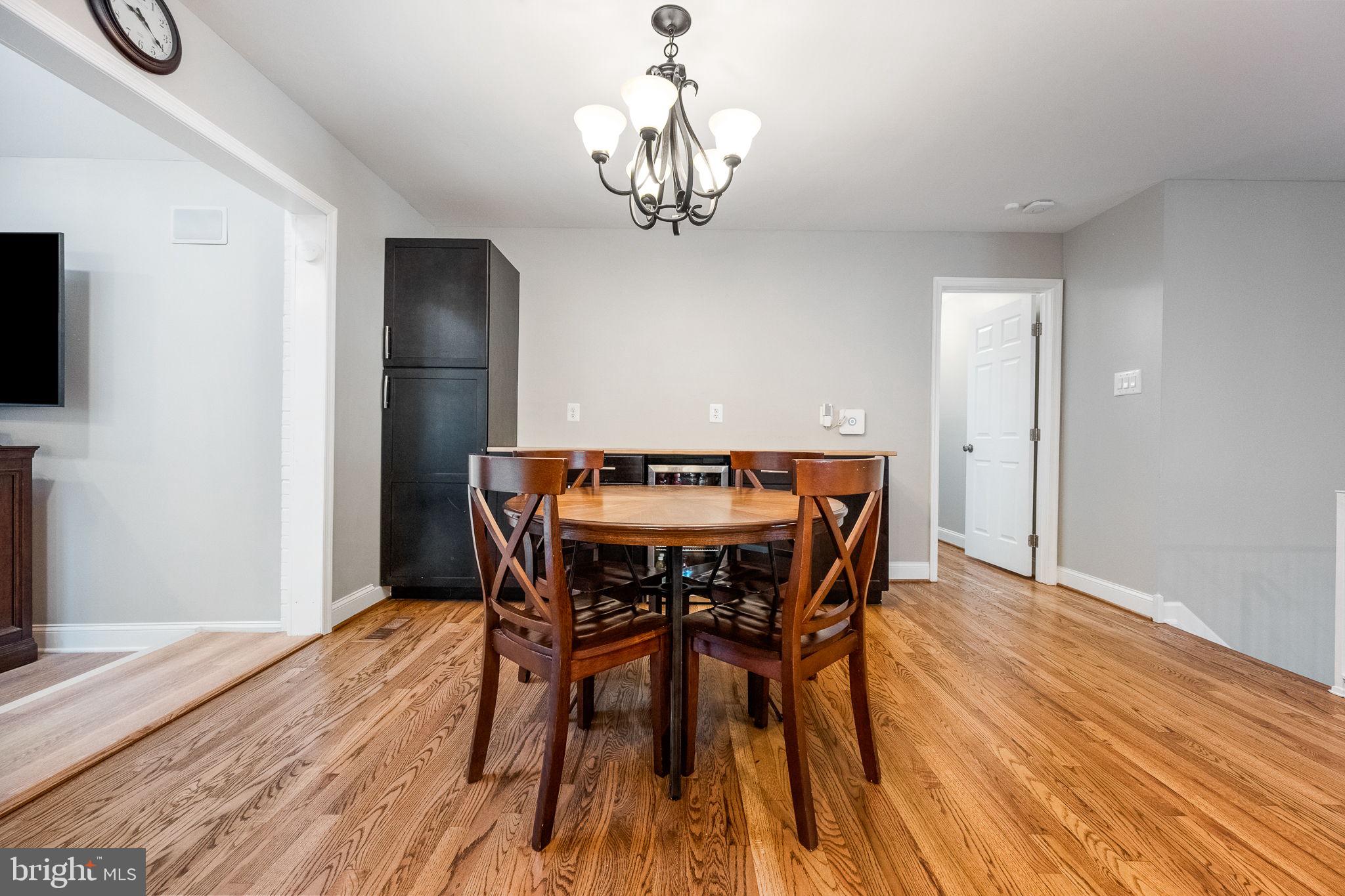 7203 Hadlow Drive Springfield, VA 22152 - Photo 11 of 39 a view of a dining room with furniture and wooden floor