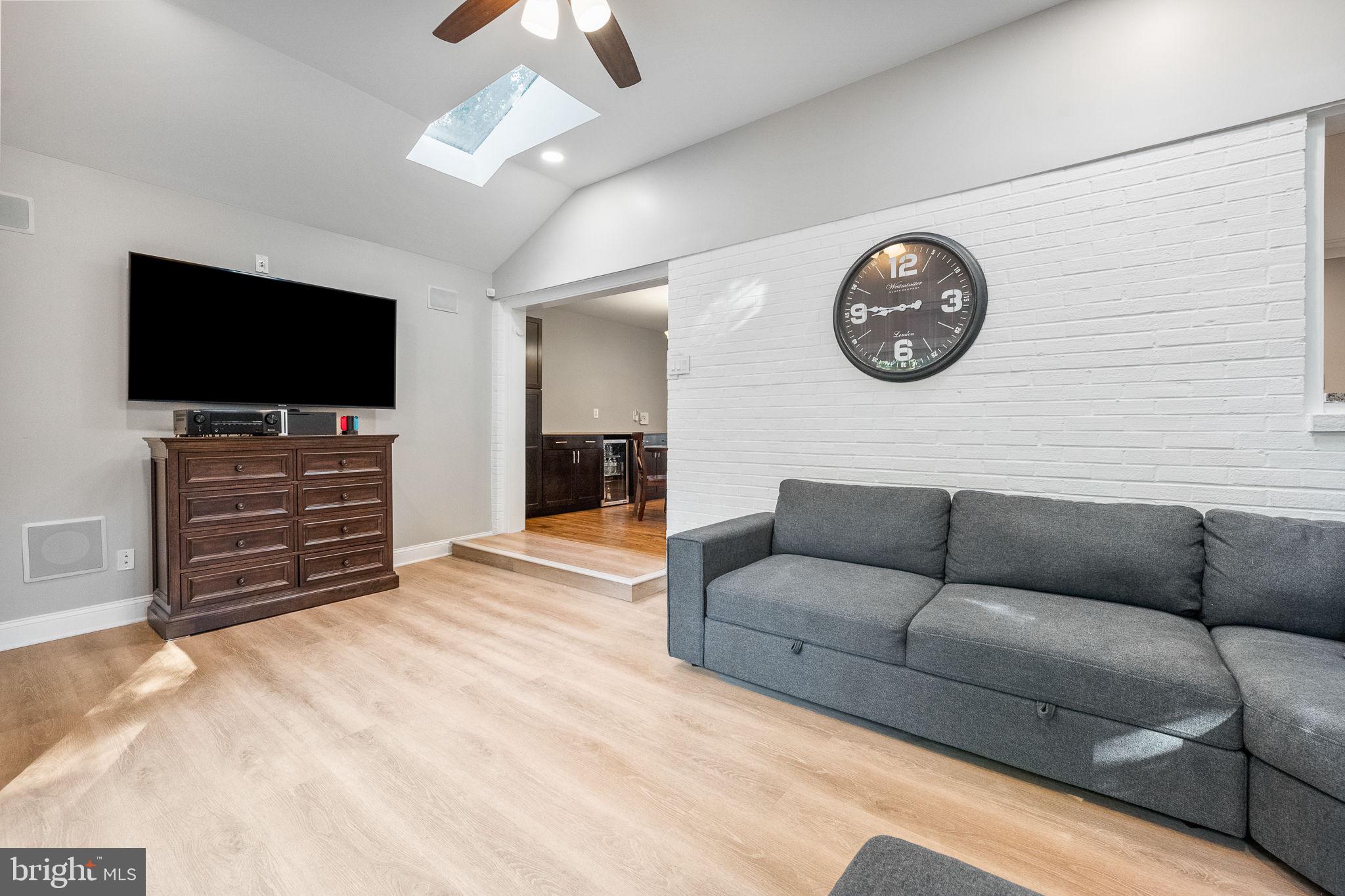 7203 Hadlow Drive Springfield, VA 22152 - Photo 14 of 39 a living room with furniture and a flat screen tv
