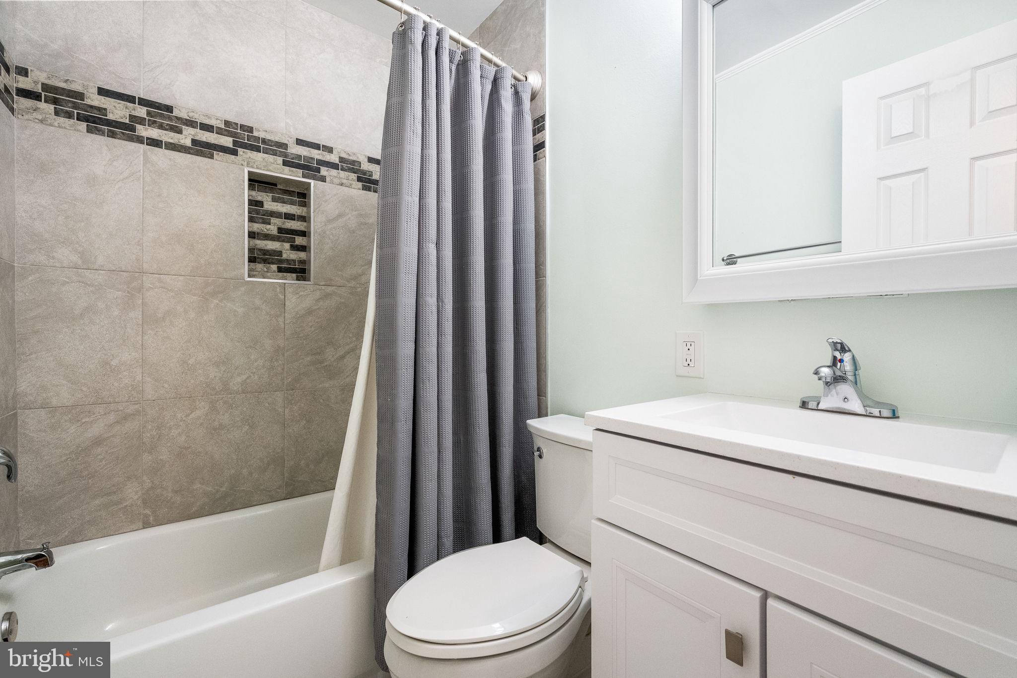 7203 Hadlow Drive Springfield, VA 22152 - Photo 16 of 39 a bathroom with a sink toilet and shower