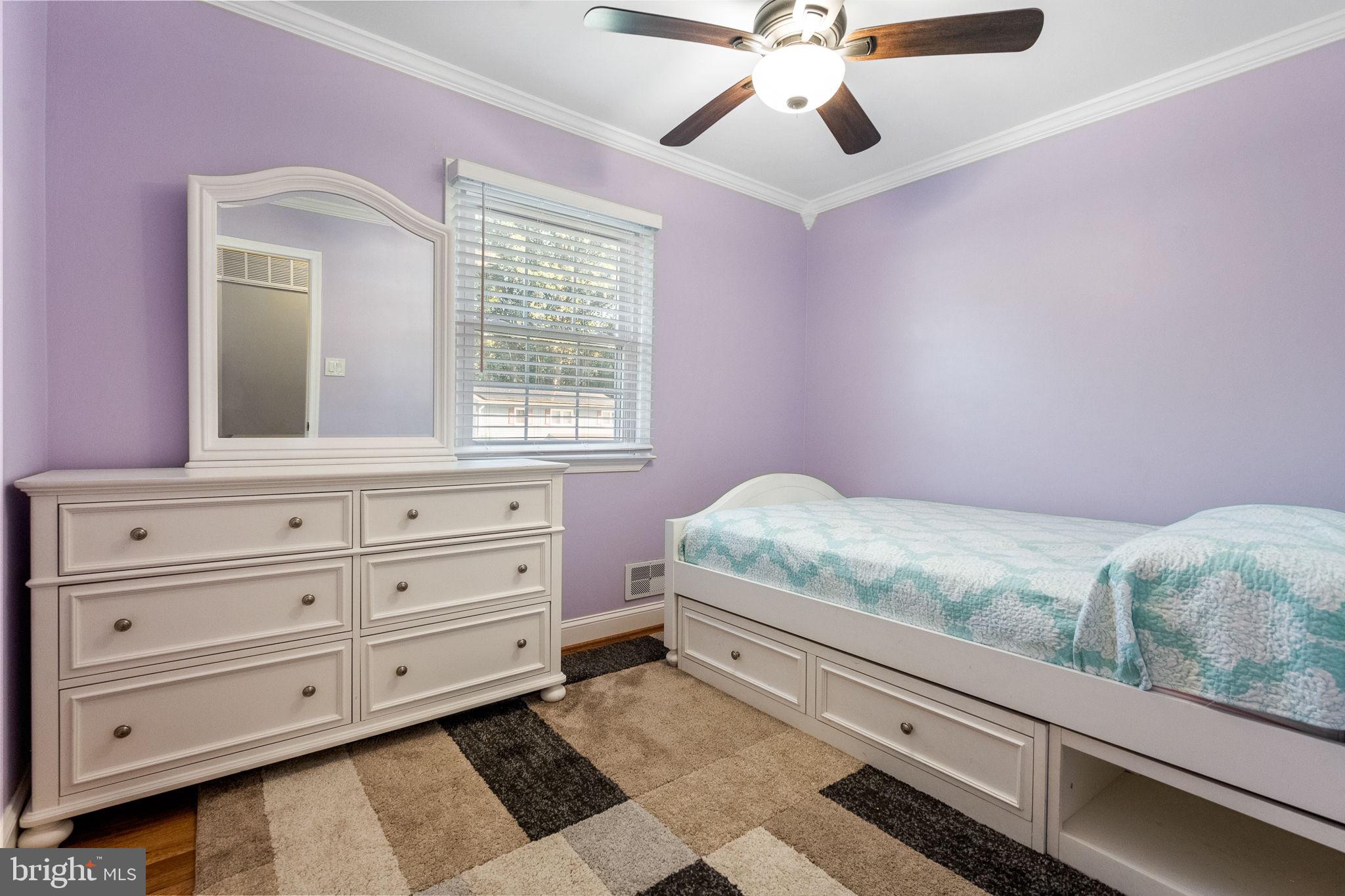 7203 Hadlow Drive Springfield, VA 22152 - Photo 18 of 39 a bedroom with a bed and a dresser