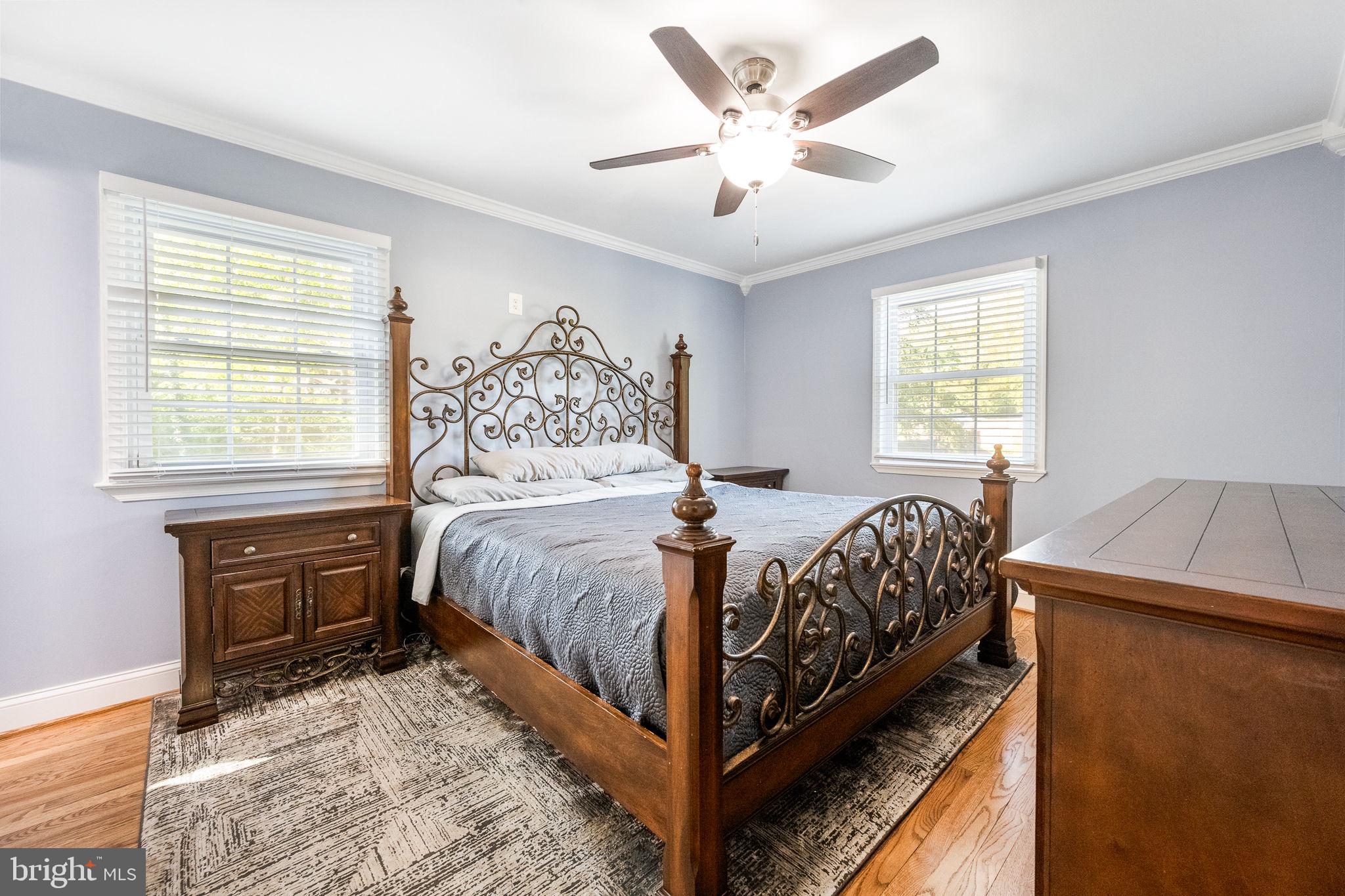 7203 Hadlow Drive Springfield, VA 22152 - Photo 21 of 39 a bed sitting in a bedroom next to a window