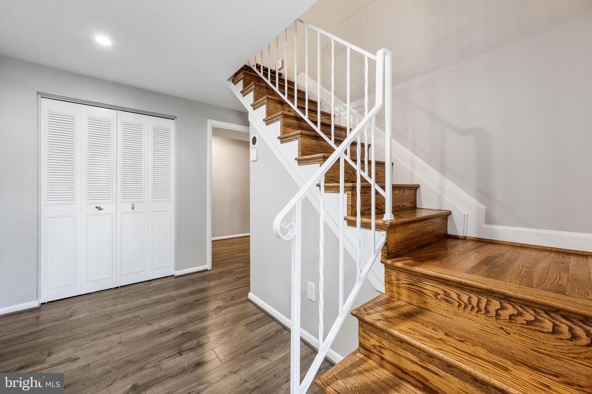 7203 Hadlow Drive Springfield, VA 22152 - Photo 24 of 39 a view of entryway and hall with wooden floor