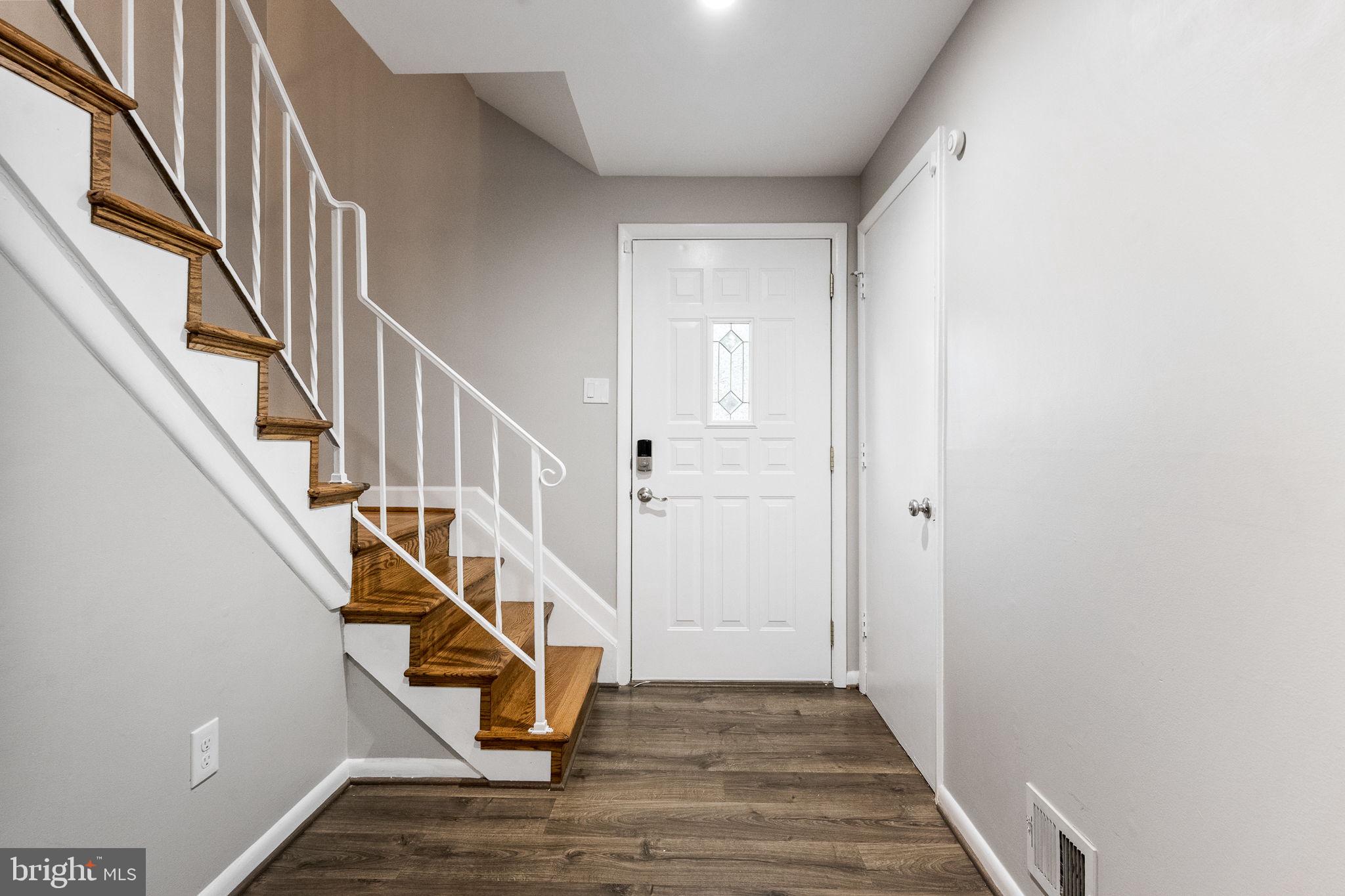 7203 Hadlow Drive Springfield, VA 22152 - Photo 25 of 39 a view of an entryway with wooden floor