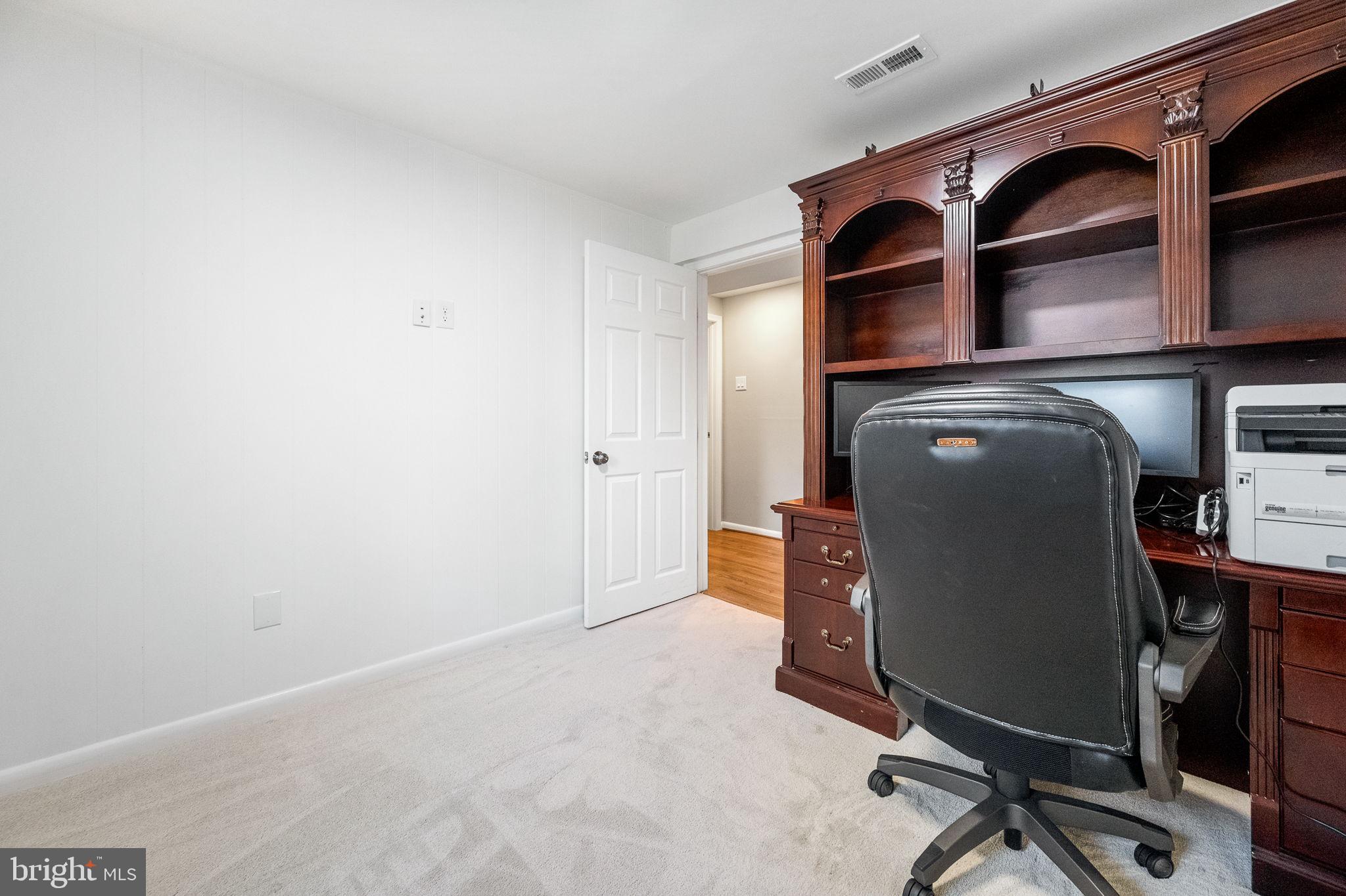 7203 Hadlow Drive Springfield, VA 22152 - Photo 28 of 39 a livingroom with a workspace