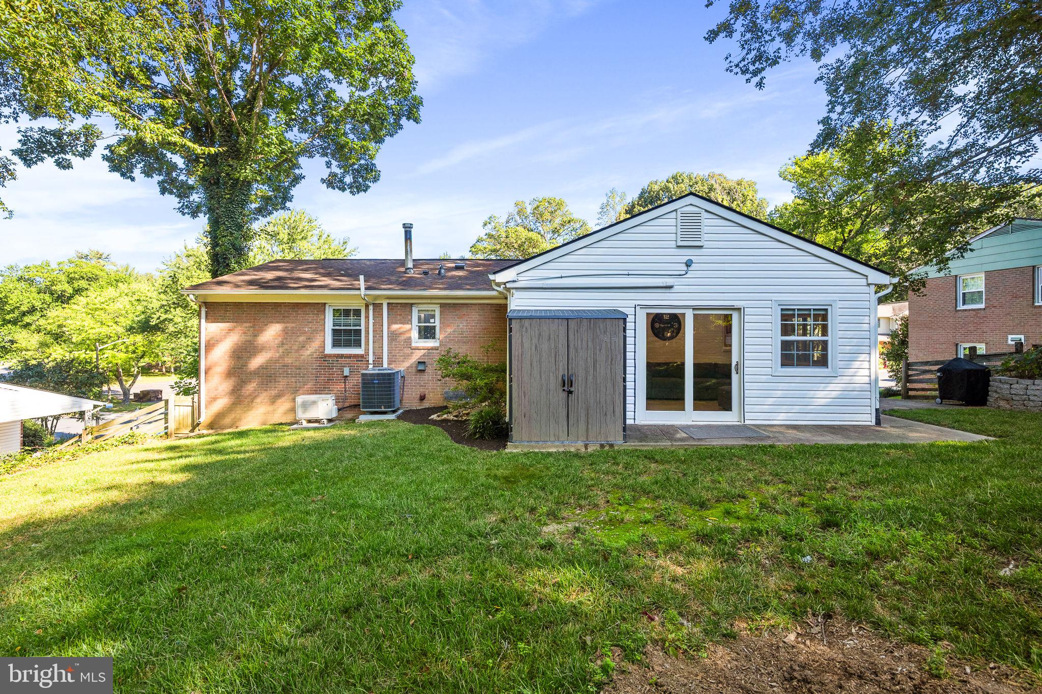 7203 Hadlow Drive Springfield, VA 22152 - Photo 34 of 39 a front view of a house with a garden