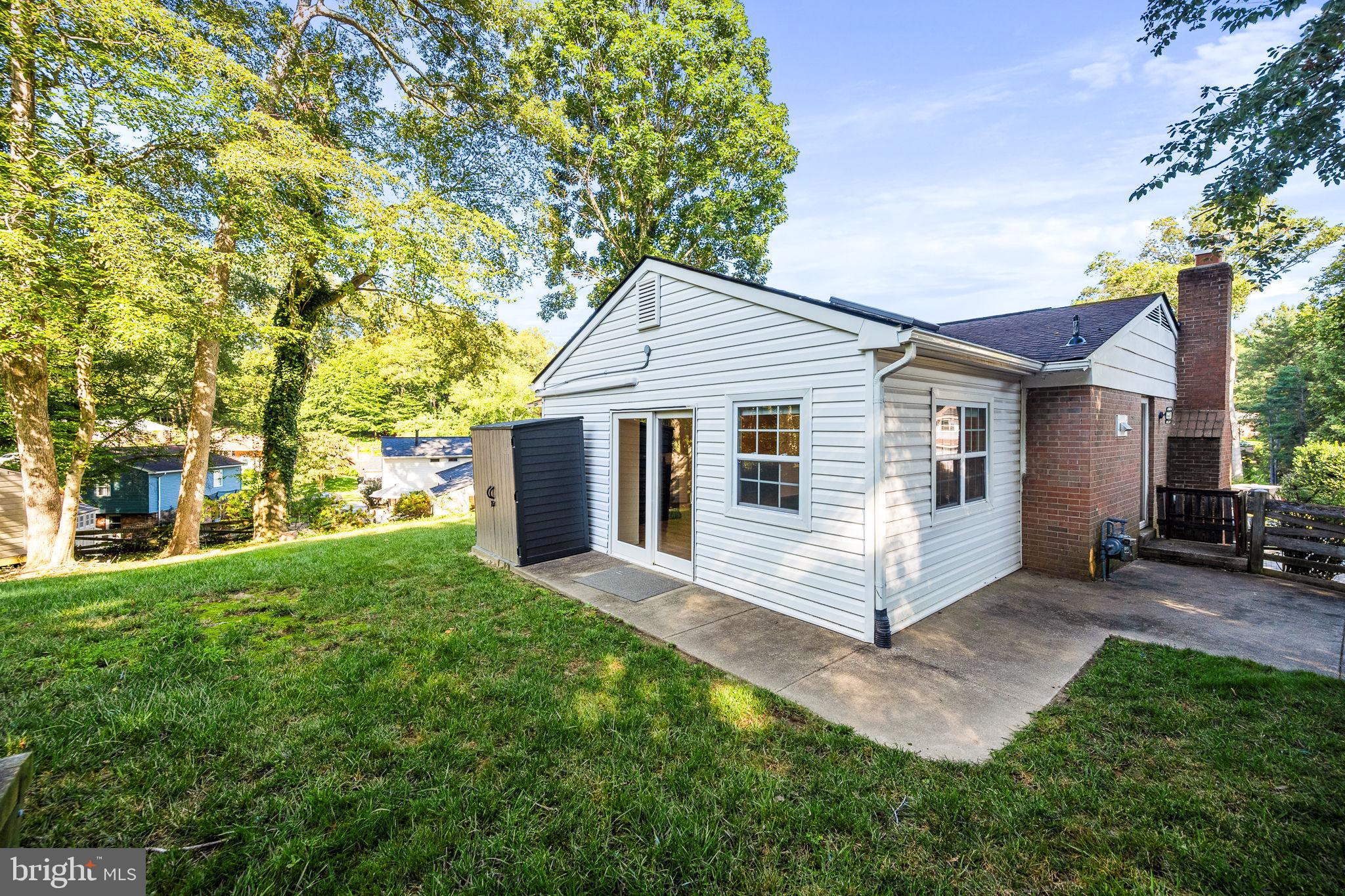 7203 Hadlow Drive Springfield, VA 22152 - Photo 35 of 39 a white house that has a tree in front of the house