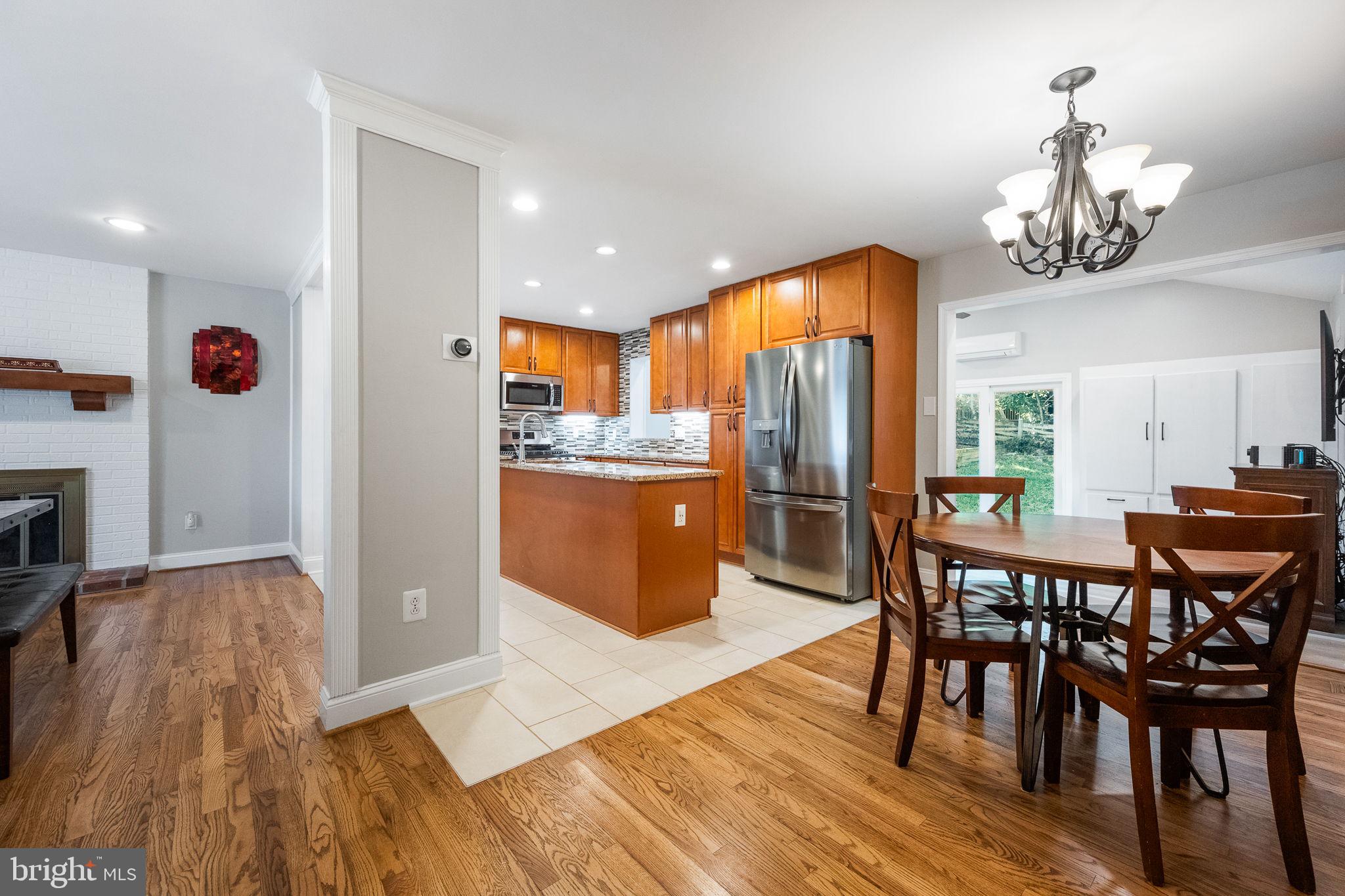 7203 Hadlow Drive Springfield, VA 22152 - Photo 8 of 39 a view of a dining room with furniture and wooden floor