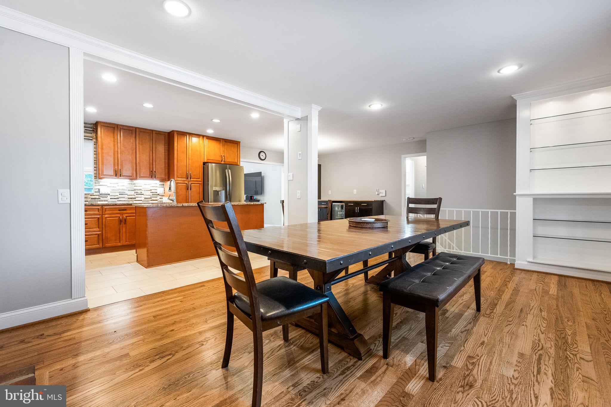 7203 Hadlow Drive Springfield, VA 22152 - Photo 9 of 39 a view of a dining room with furniture and wooden floor