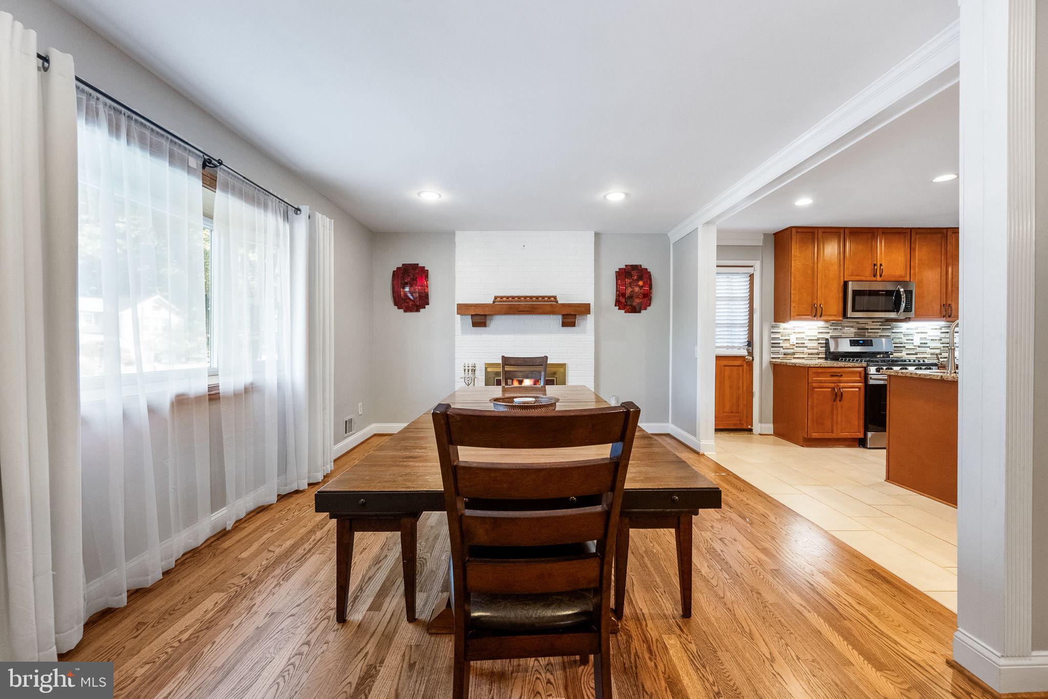 7203 Hadlow Drive Springfield, VA 22152 - Photo 10 of 39 a view of a dining room with furniture window and wooden floor