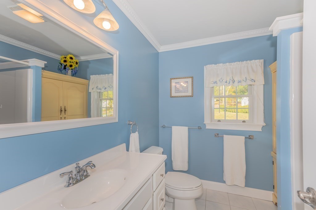 23 Craig Road Holland, MA 01521 - Photo 14 of 40 a bathroom with a sink a toilet and window