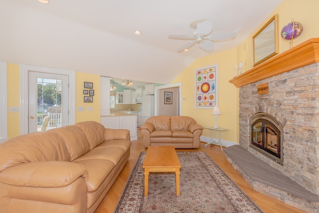 23 Craig Road Holland, MA 01521 - Photo 5 of 40 a living room with furniture a fireplace and a large window