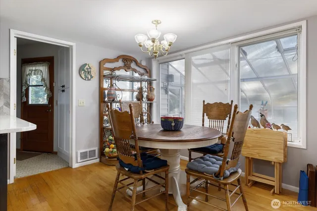 a kitchen with a refrigerator and cabinets