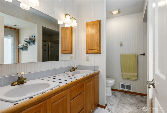 a bed room with furniture and wooden floor