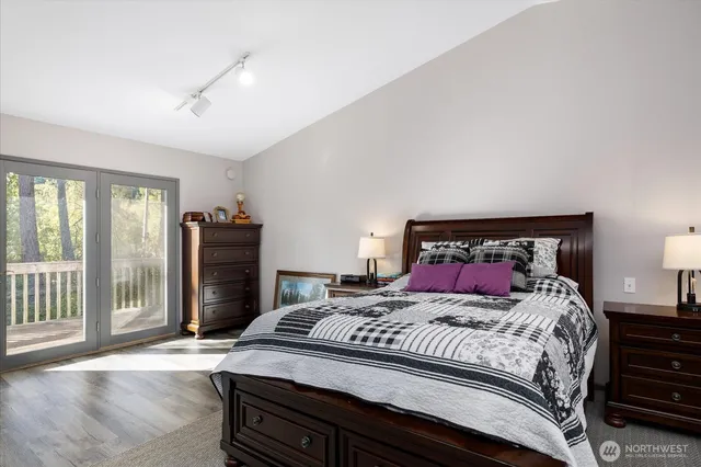 a bedroom with a bed and a book shelf