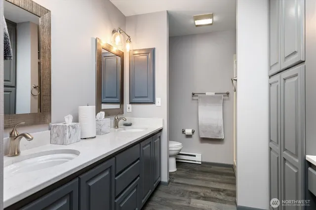 a bathroom with a sink and mirror