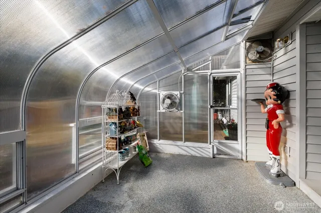 a view of a house with a yard and sitting area