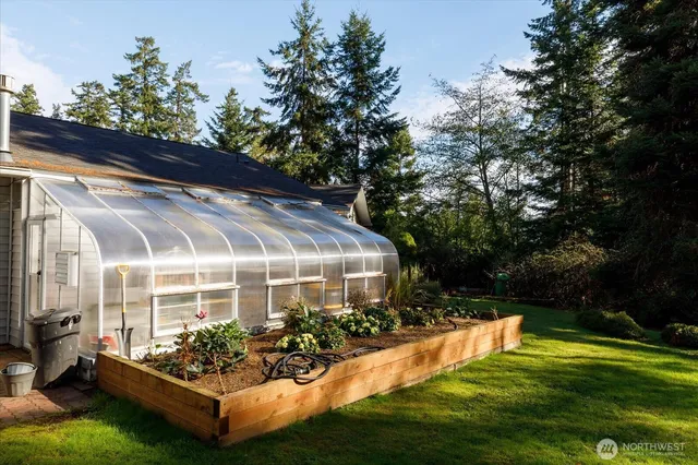 a view of a house with a yard porch and sitting area