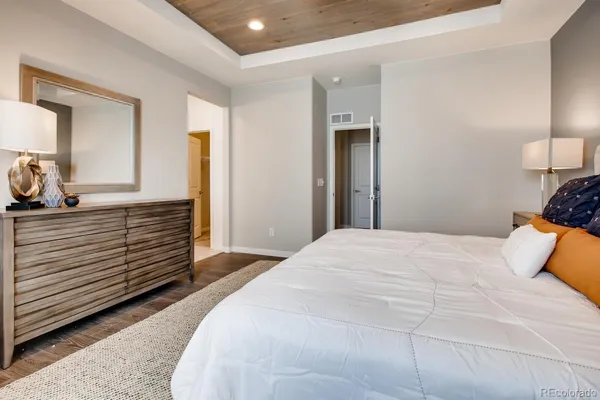 a bedroom with a bed and a dresser