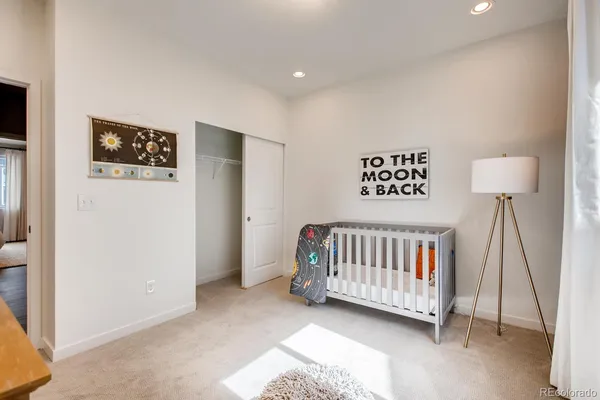 a view of a bedroom from a hallway
