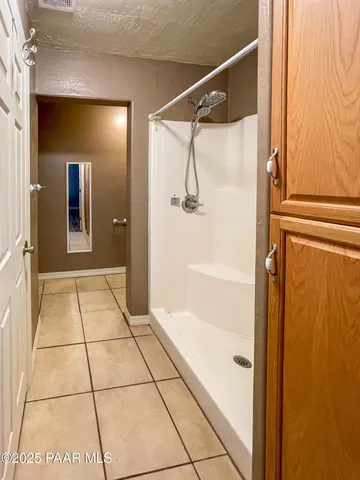 a kitchen with stainless steel appliances granite countertop a sink and a refrigerator