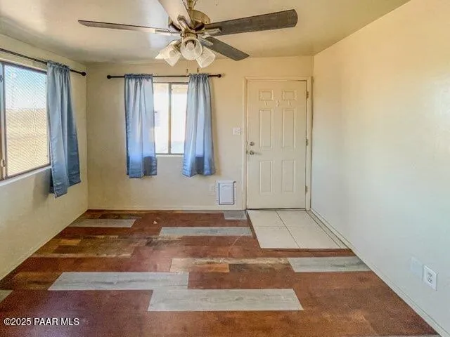 a view of hallway with wooden floor