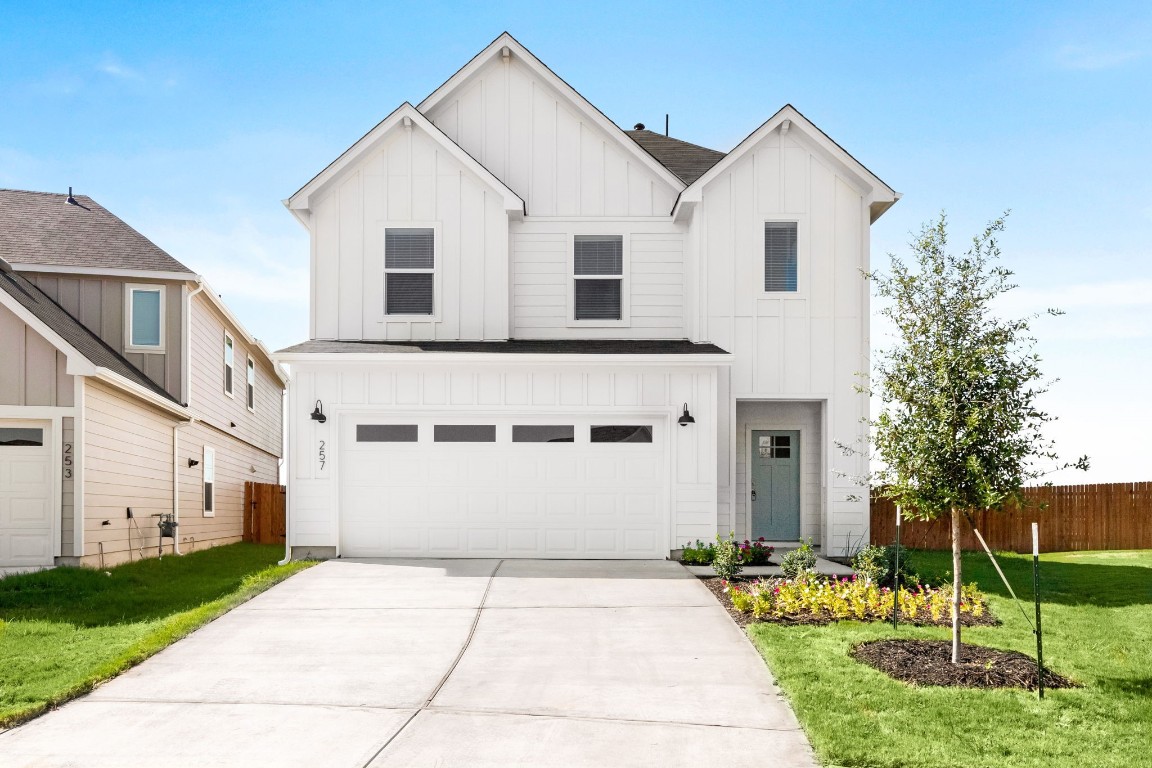 257 Frogmore Loop Kyle, TX 78640 - Photo 1 of 1 a view of white house with a yard