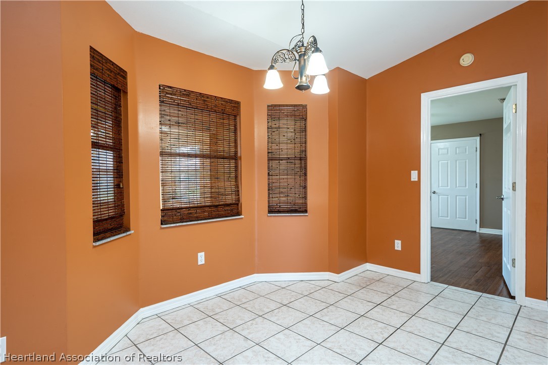 309 Lark Terrace Sebring, FL 33872 - Photo 12 of 32 a view of a bedroom with windows