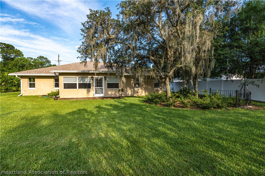 309 Lark Terrace Sebring, FL 33872 - Photo 26 of 32 a house view with a garden space