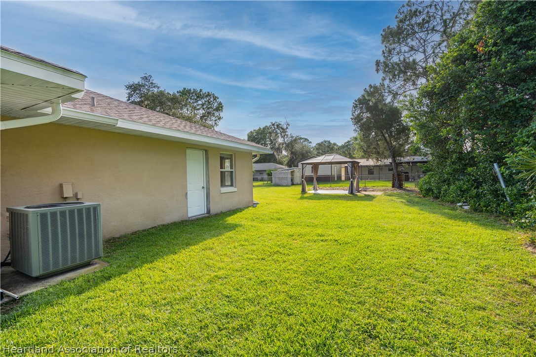 309 Lark Terrace Sebring, FL 33872 - Photo 27 of 32 a view of a backyard with swimming pool
